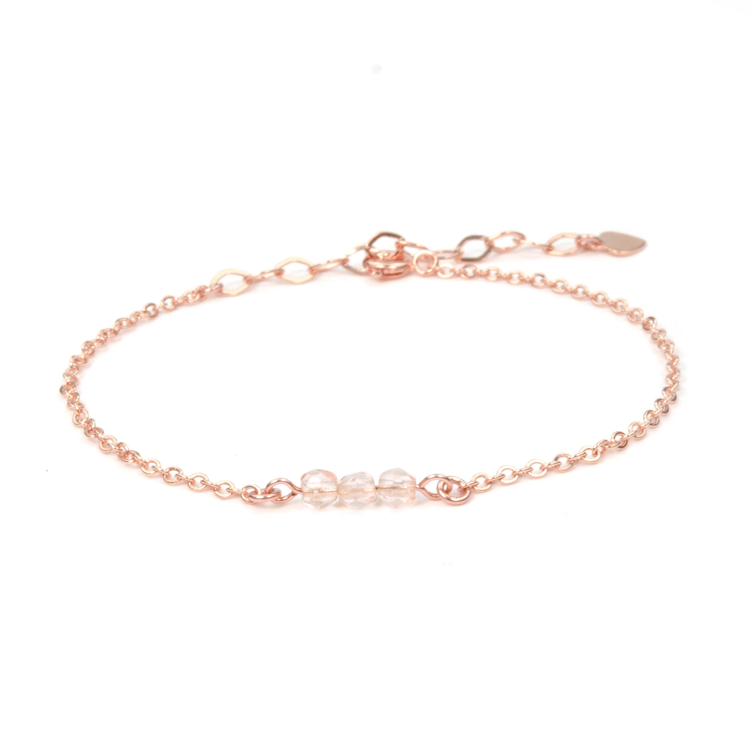 Armband vergoldet mit 3 facettierten rosa Glasperlen